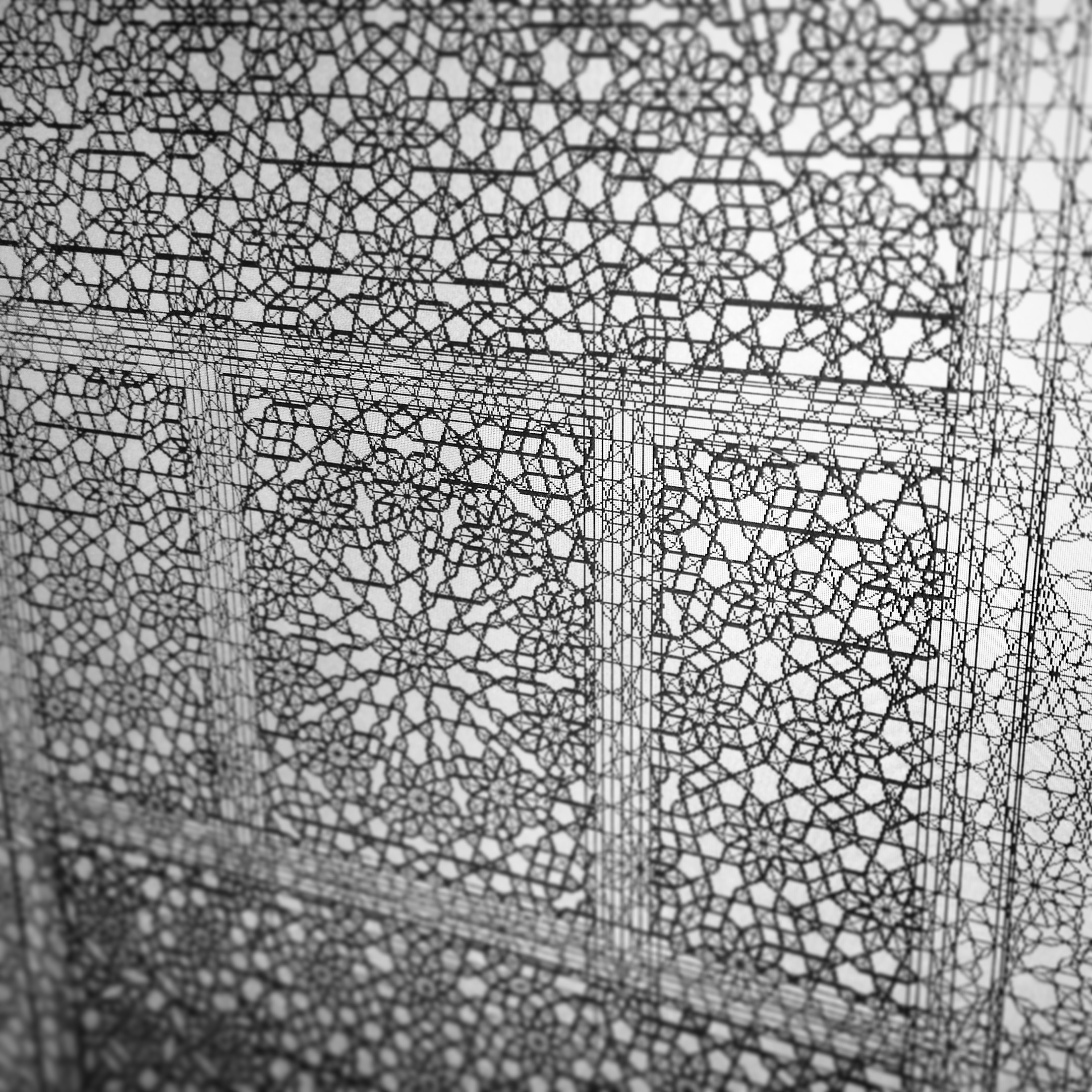 Close-up detail of geometric tiling pattern with intricate star motifs